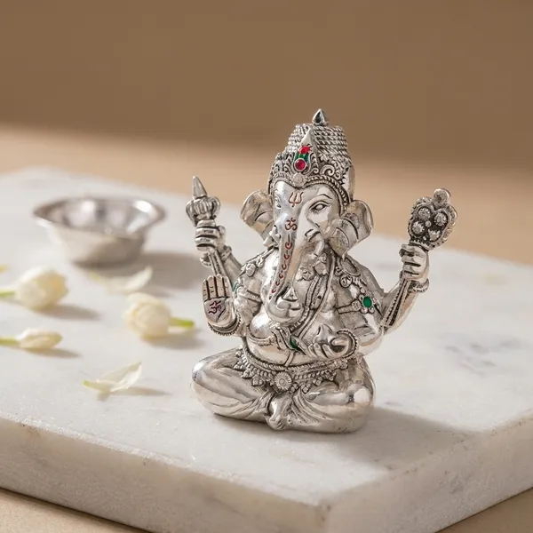 New_Ganesha_-_Silver_Idol_With_Blue_Orchid_Decoration