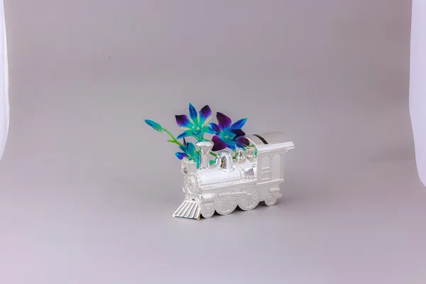 Silver-Plated_Train_Engine_Flower_Vase_With_Blue_Orchids