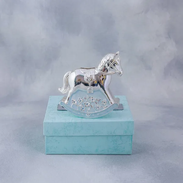 Silver_Rocking_Horse_Decorative_Showpiece_On_Blue_Gift_Box