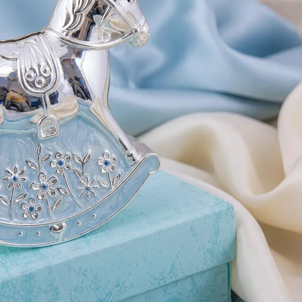 Silver_Rocking_Horse_Decorative_Showpiece_On_Blue_Gift_Box