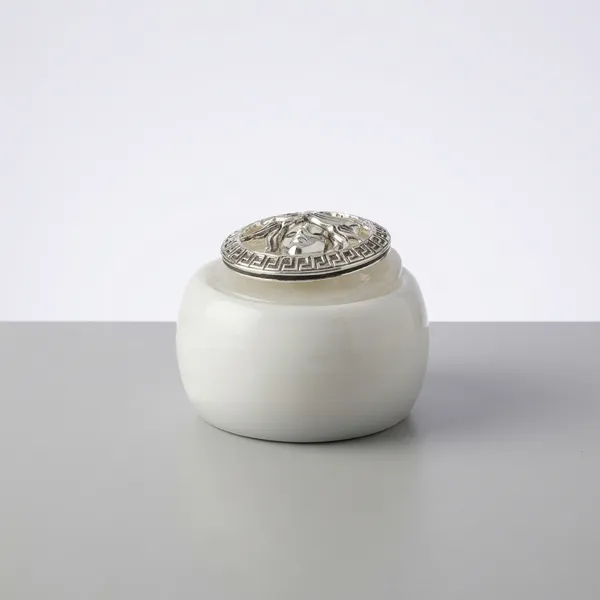 White_Ceramic_Jar_With_Decorative_Silver_Lid