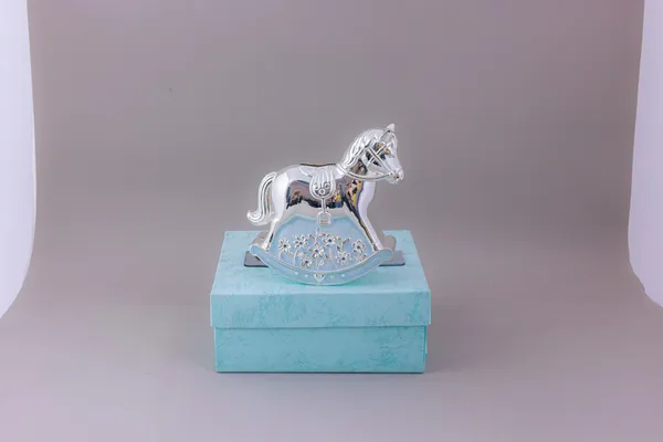 Silver_Rocking_Horse_Decorative_Showpiece_On_Blue_Gift_Box
