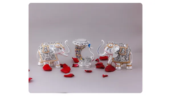 Decorative_Elephant_Figurines_Set_With_Floral_Embellishments_And_Vase