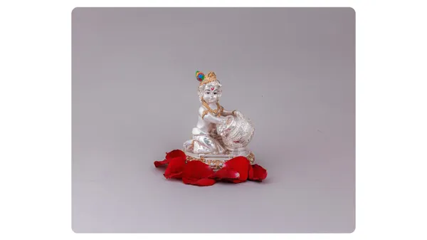Decorative_White_And_Gold_Goddess_Figurine_With_Red_Ribbon