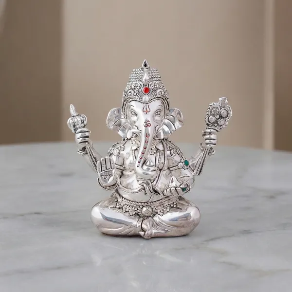 Silver-Plated_Lord_Ganesha_Idol_With_Blue_Orchid_Flowers