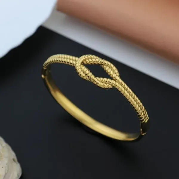 Elegant_Gold_Tone_Knot_Bangle_Bracelet_For_Women