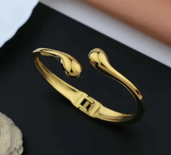 Gold_Toned_Open_Cuff_Bracelet_With_Teardrop_Ends_For_Women