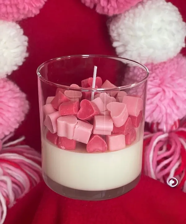 Pink_Heart-Shaped_Wax_Candle_In_Glass_Holder_With_White_Base