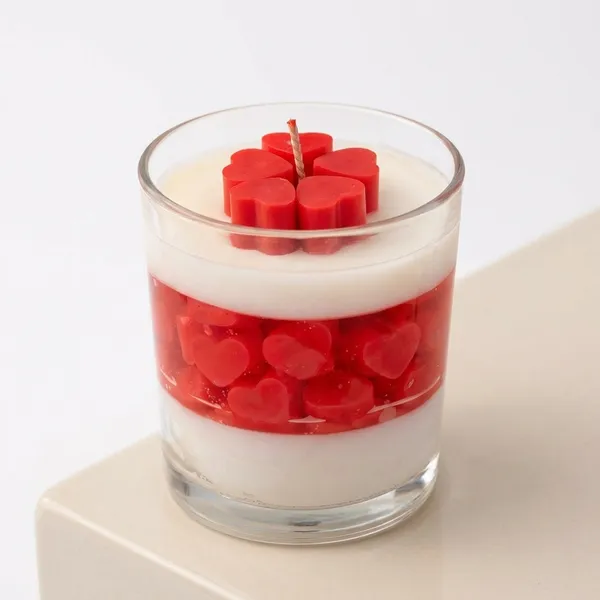 Layered_Red_Heart_Jelly_Dessert_Cup_With_Creamy_White_Layers_Candle