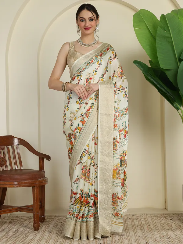 Ivory_White_Banarasi_Art_Silk_Saree_with_Traditional_Folk_Dance_Print_&_Elegant_Zari_Border