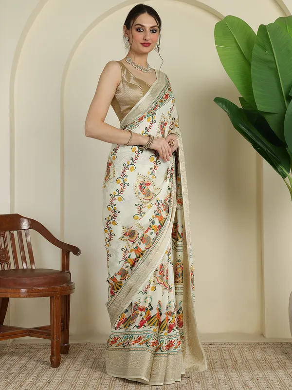 Ivory_White_Banarasi_Art_Silk_Saree_with_Traditional_Folk_Dance_Print_&_Elegant_Zari_Border