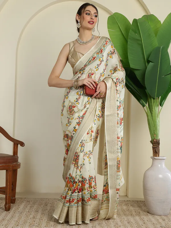 Ivory_White_Banarasi_Art_Silk_Saree_with_Traditional_Folk_Dance_Print_&_Elegant_Zari_Border
