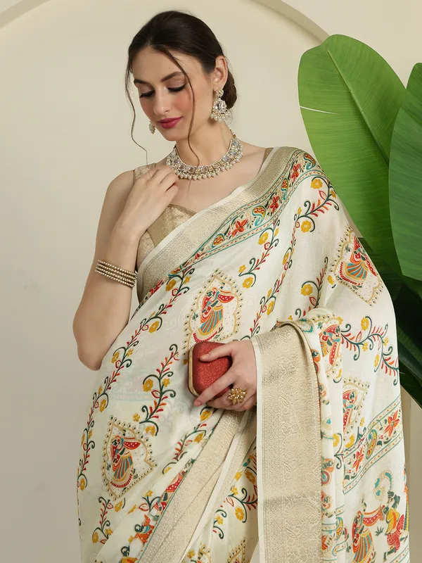 Ivory_White_Banarasi_Art_Silk_Saree_with_Traditional_Folk_Dance_Print_&_Elegant_Zari_Border