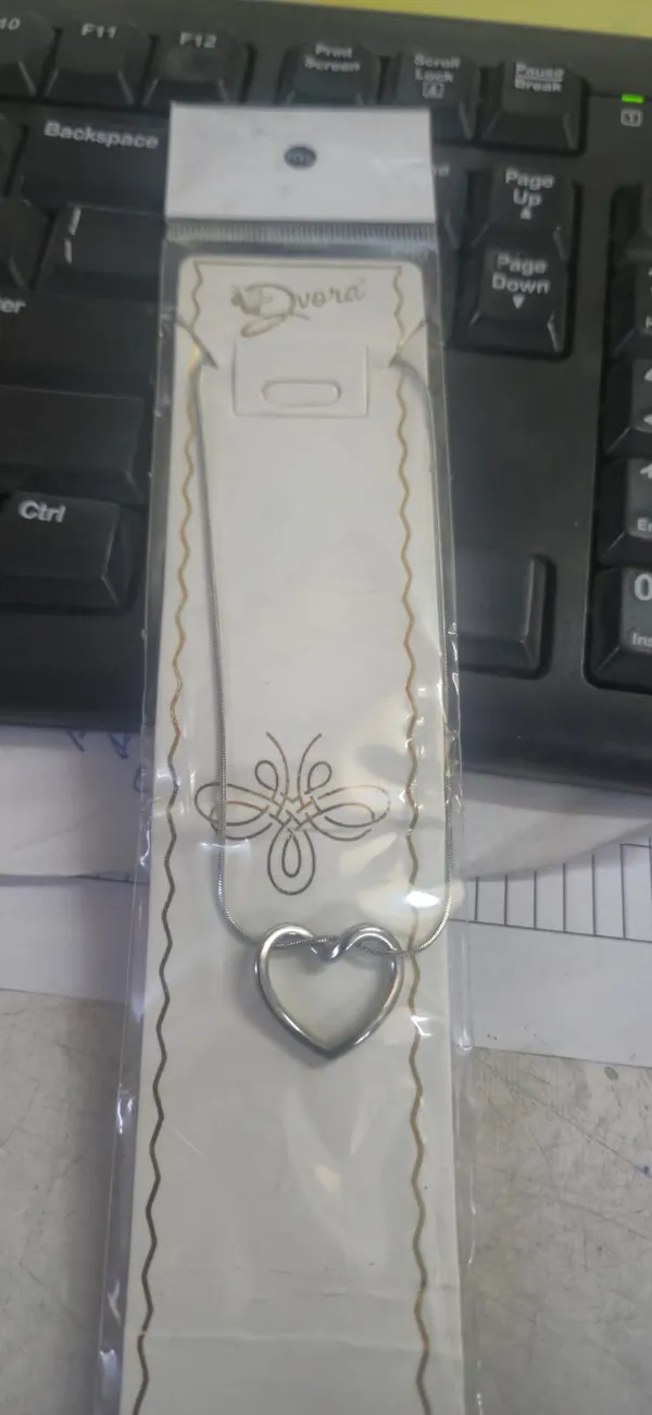 Elegant_White_Bookmark_with_Heart_Charm_and_Decorative_Border