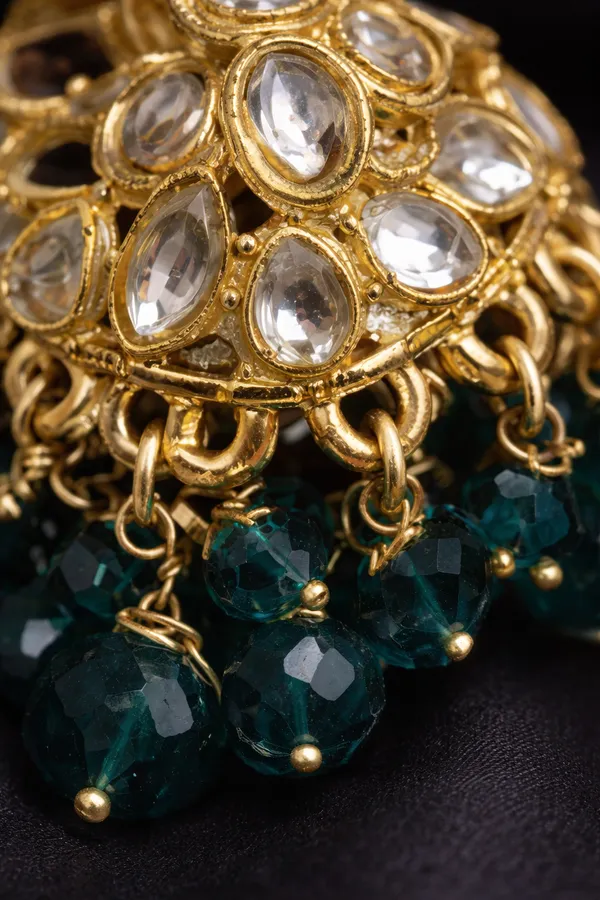 Kundan_Earrings__Enhance_your_look_with_these_elegant_Kundan_earrings,_crafted_to_add_a_touch_of_traditional_charm.__Material:_Mixed_Metal_Stone_Work:_Kundan_stones_and_moti_work_light_weight_jhumki_Size:_2_inches_Care_Instructions:__Store_in_a_zip-lock_pouch_after_use_to_maintain_shine_and_longevity_Avoid_contact_with_water,_perfume,_or_any_chemicals_Perfect_for_festive_occasions,_weddings,_or_adding_a_graceful_touch_to_your_everyday_style_???