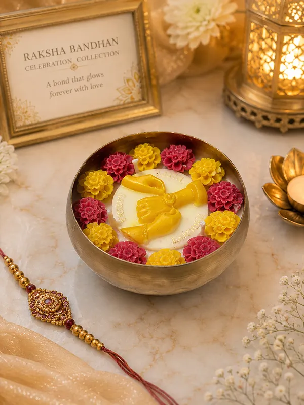 Raksha_Bandhan_Celebration_Urli_Candle–_Brass_Bowl_with_Floral_Wax_Flowers_&_Golden_Bond_Motif