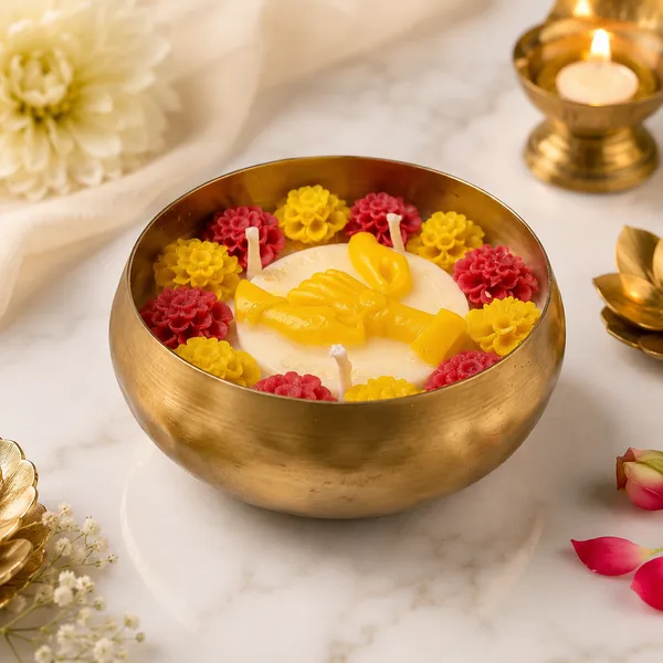 Raksha_Bandhan_Celebration_Urli_Candle–_Brass_Bowl_with_Floral_Wax_Flowers_&_Golden_Bond_Motif