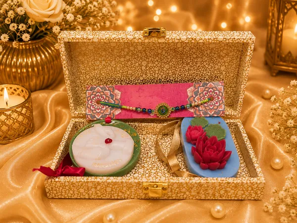 Royal_Rakhi_Keepsake_Box_–_Premium_Raksha_Bandhan_Gift_Set_with_Designer_Evil_Eye_Rakhi,_Bhaiya-Bhabhi_Candle_&_Lotus_Floral_Candle_|_Luxury_Gift_for_Brother