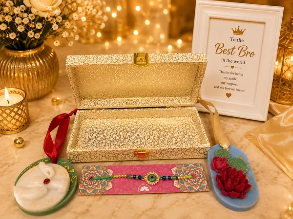 Royal_Rakhi_Keepsake_Box_–_Premium_Raksha_Bandhan_Gift_Set_with_Designer_Evil_Eye_Rakhi,_Bhaiya-Bhabhi_Candle_&_Lotus_Floral_Candle_|_Luxury_Gift_for_Brother