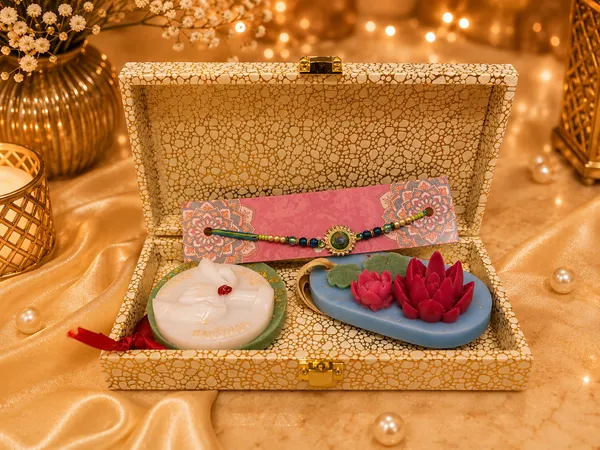 Royal_Rakhi_Keepsake_Box_–_Premium_Raksha_Bandhan_Gift_Set_with_Designer_Evil_Eye_Rakhi,_Bhaiya-Bhabhi_Candle_&_Lotus_Floral_Candle_|_Luxury_Gift_for_Brother
