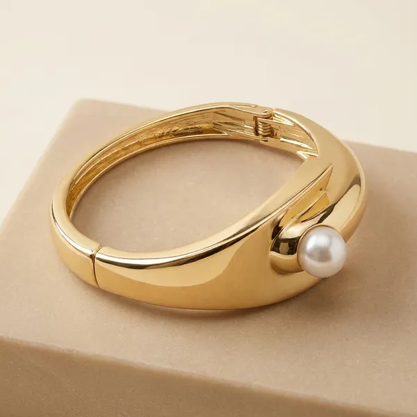 Elegant_Gold-Toned_Pearl_Cuff_Bracelet_With_Geometric_Design