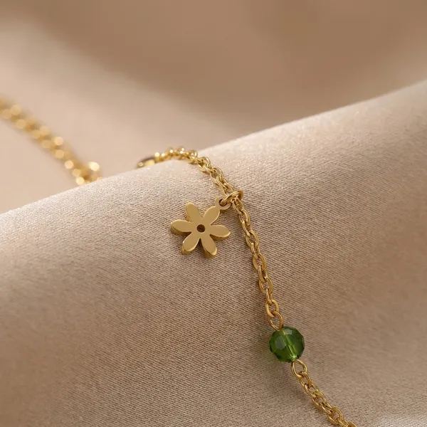 Gold-Toned_Charm_Bracelet_With_Delicate_Dangling_Accents_For_Women