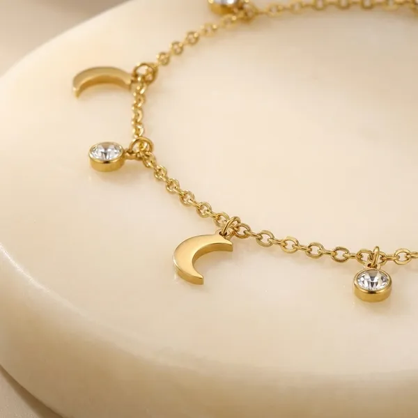 Elegant_Gold-Tone_Celestial_Charm_Bracelet_With_Moon,_Star_&_Sun_Pendants_For_Women