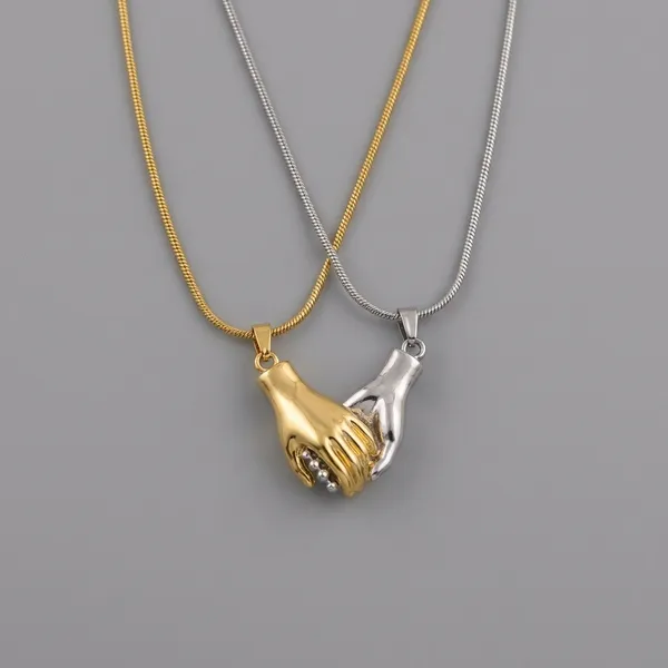 Gold_&_Silver_Matching_Hand_Holding_Pendant_Necklace_For_Women