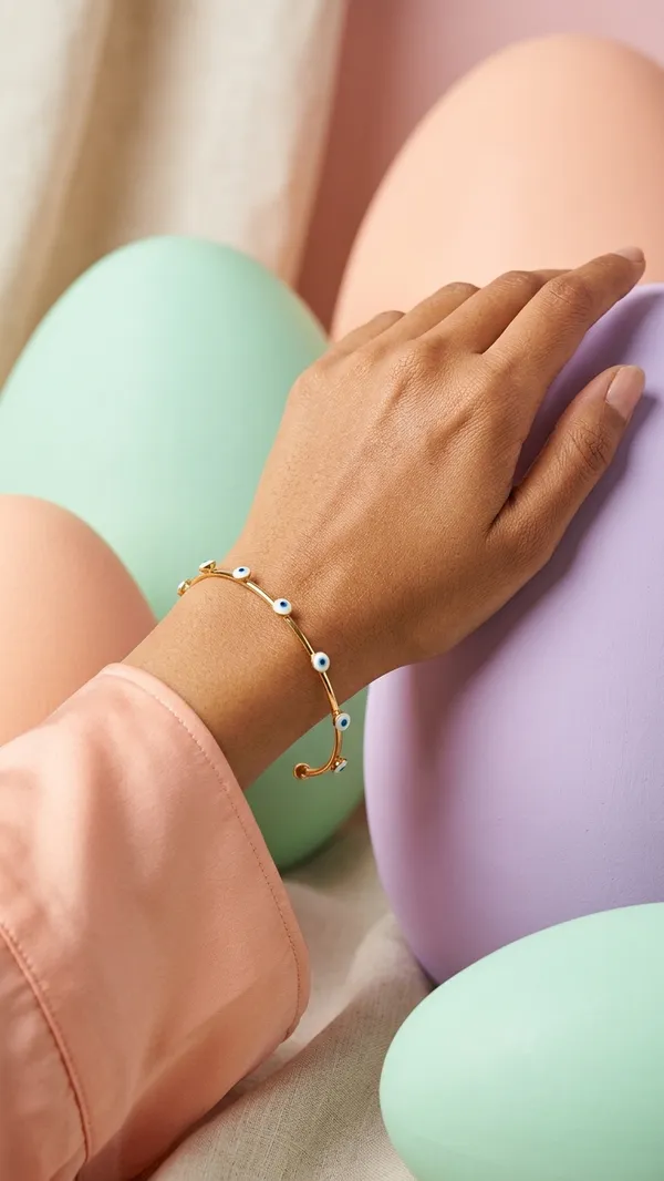 Gold_Tone_Bangle_With_Blue_Evil_Eye_Charms_For_Women