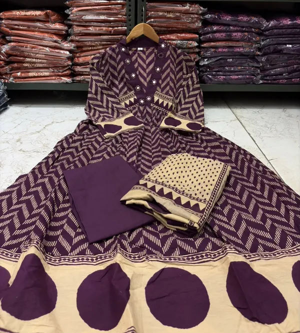 Wine_A-line_kurta_set_with_Mirror_work_on_Neck_line_paired_with_Matchin_pant_and_Soft_Mul_Dupatta