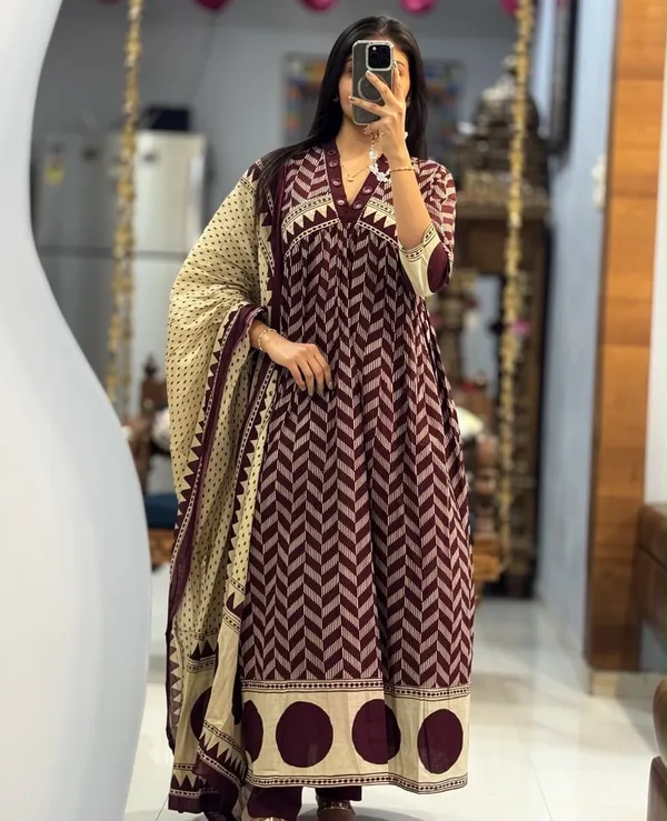 Wine_A-line_kurta_set_with_Mirror_work_on_Neck_line_paired_with_Matchin_pant_and_Soft_Mul_Dupatta