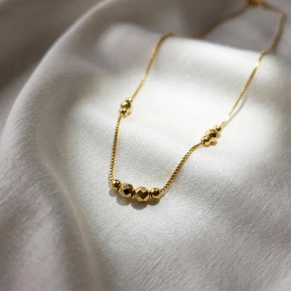 Billie__Diamond-Cut_Gold_Bead_Necklace