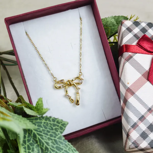 Britta_Gilded_Knot_Bow_Crystal_Pendant_Necklace