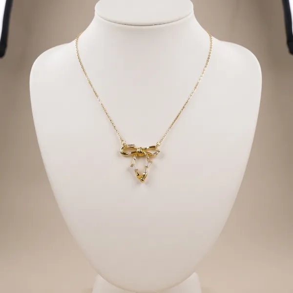 Britta_Gilded_Knot_Bow_Crystal_Pendant_Necklace