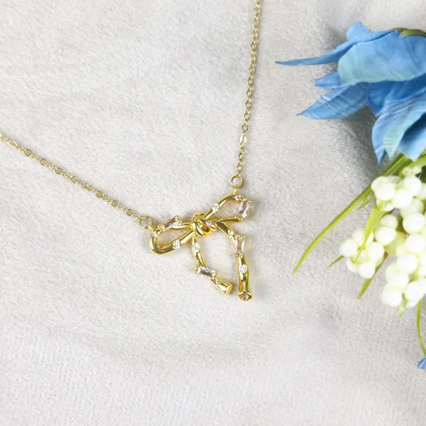 Britta_Gilded_Knot_Bow_Crystal_Pendant_Necklace
