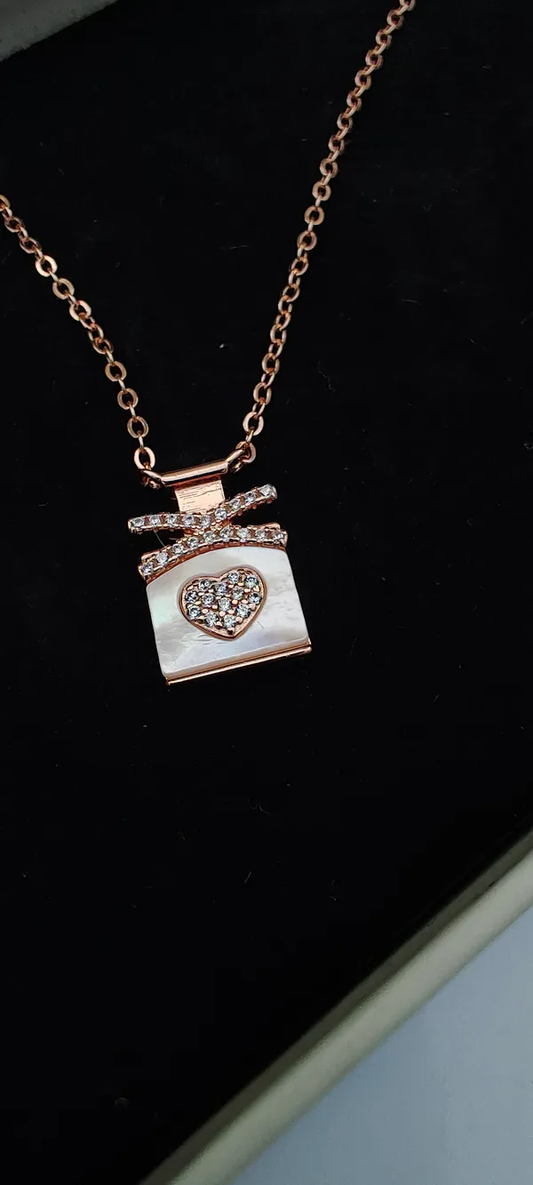 Rose_Gold_Perfume_Bottle_Pendant_Necklace_with_Heart_and_Crystal_Accents