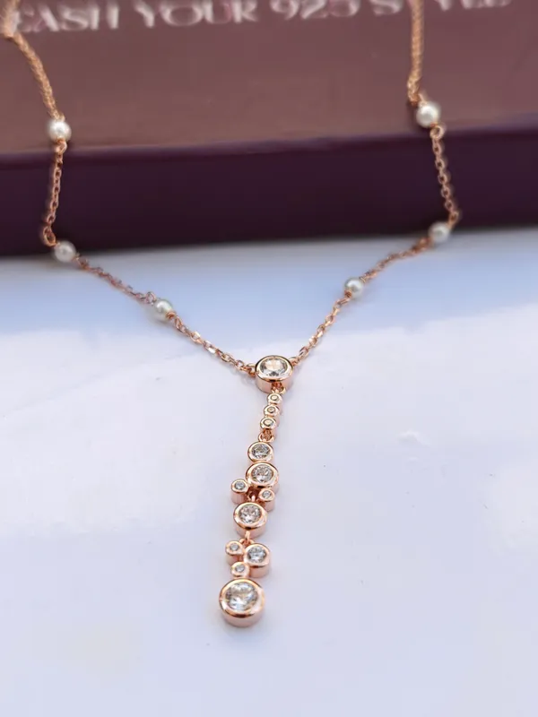 Elegant_Rose_Gold_Crystal_Drop_Necklace_with_Pearl_Accents