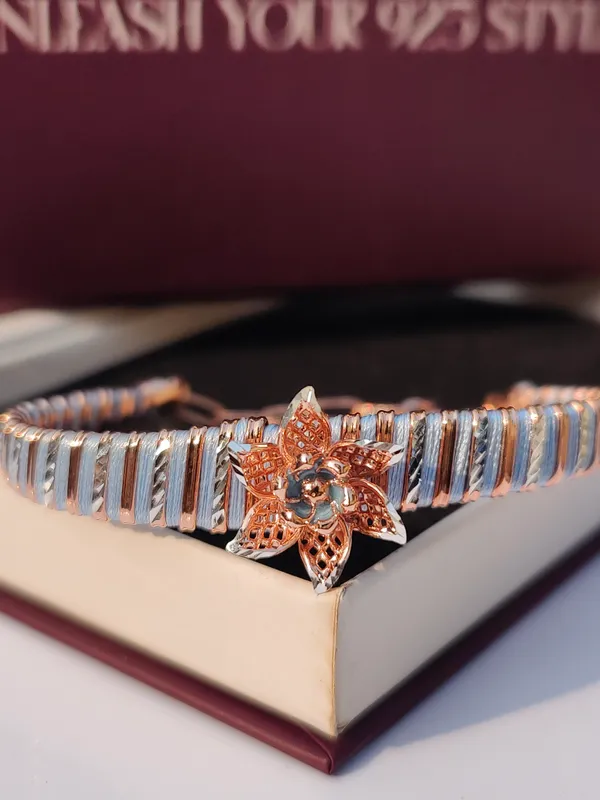 Elegant_Silver_and_Rose_Gold_Tone_Floral_Bracelet_with_Crystal_Accent