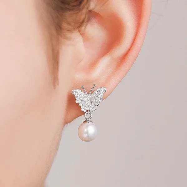 Butterfly_Motif_Pearl_Drop_earrings_in_925_Silver_by_SVADEZI