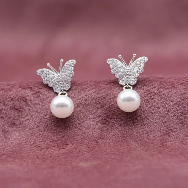 Butterfly_Motif_Pearl_Drop_earrings_in_925_Silver_by_SVADEZI