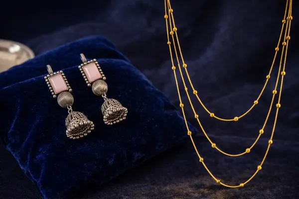 Golden_Beaded_Necklace__And__Oxidized_Silver_Jhumka_Earrings_with_Pink_Stone_for_Women_Pack_Of_2