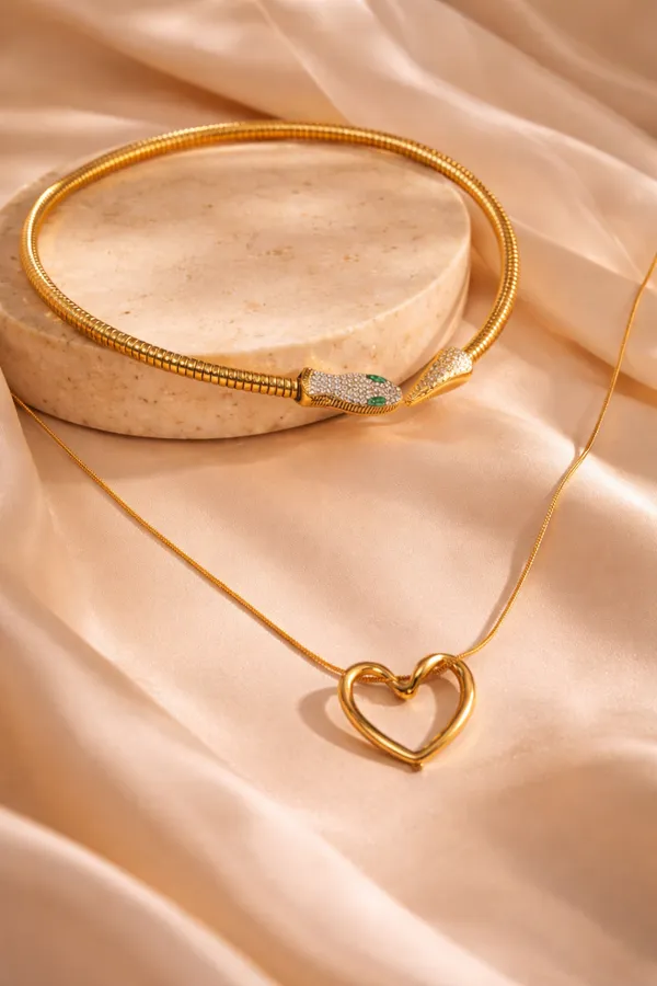 Gold_Toned_Heart_Pendant_Necklace_with_Delicate_Chain__And__Snake_Head_Necklace_with_Green_Stone_Accents_for_Women_Pack_Of_2
