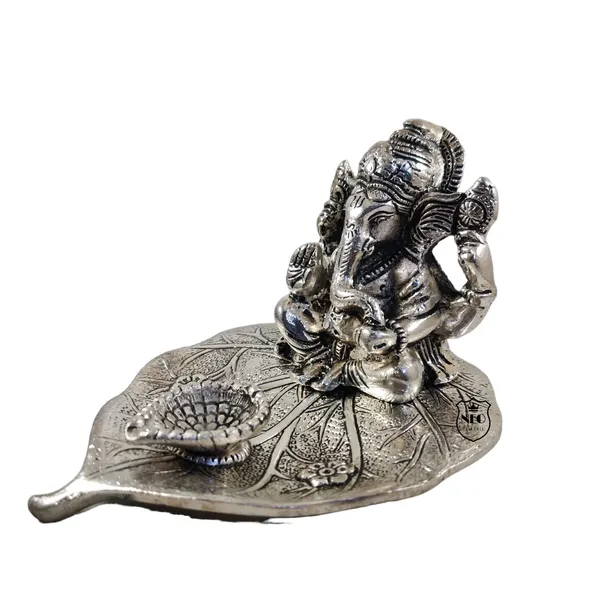 Ganesh_Idol_On_Leaf_Deepak_Lord_Ganesha_With_Diya_Metal_Hand_Craved_For_Home_Decorative_Gift_Puja_Gifts_Corporate_Gift_Silver