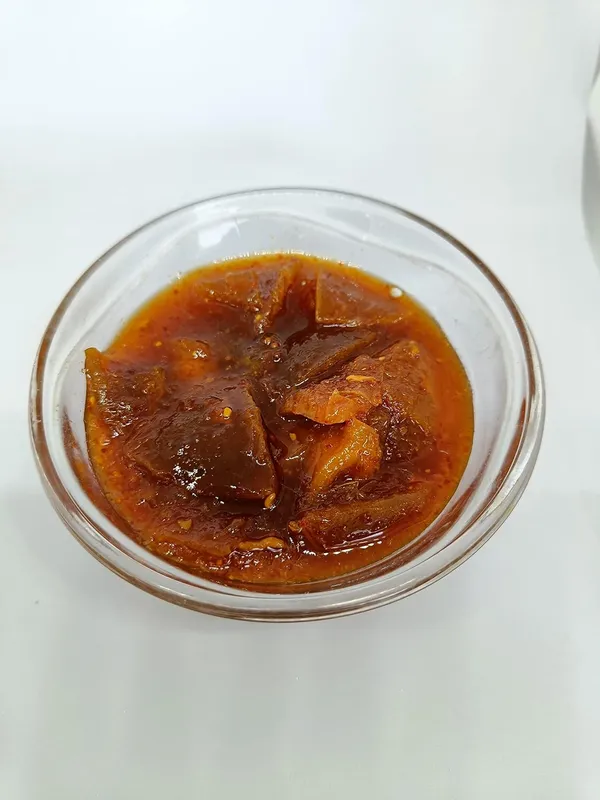 Organic_Homemade_Nimadi_Lemon_Pickles_Khatta_Meetha_Nimbu_Ka_Achar_With_Neemwood_Spoon_Flavourful_Delicious_Traditional_Taste