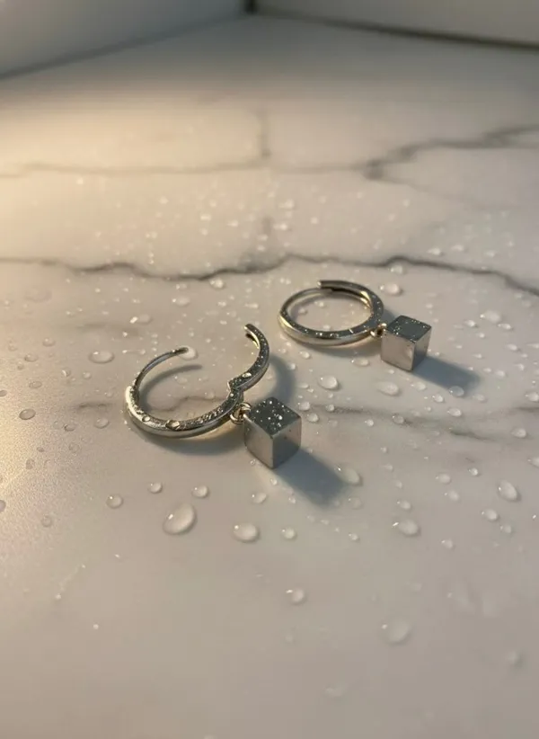 Silver_Hoop_Earrings_With_Black_Cube_Charm