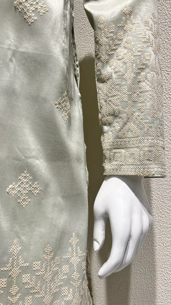 Pastel_Mint_Kurta_for_Men_featuring_Intricate_Threadwork_and_Geometric_Patterns