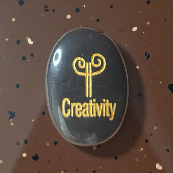 Zibu_Symbol_Palm_Stone_Creativity_Symbol_Engraved_On_Black_Tourmaline