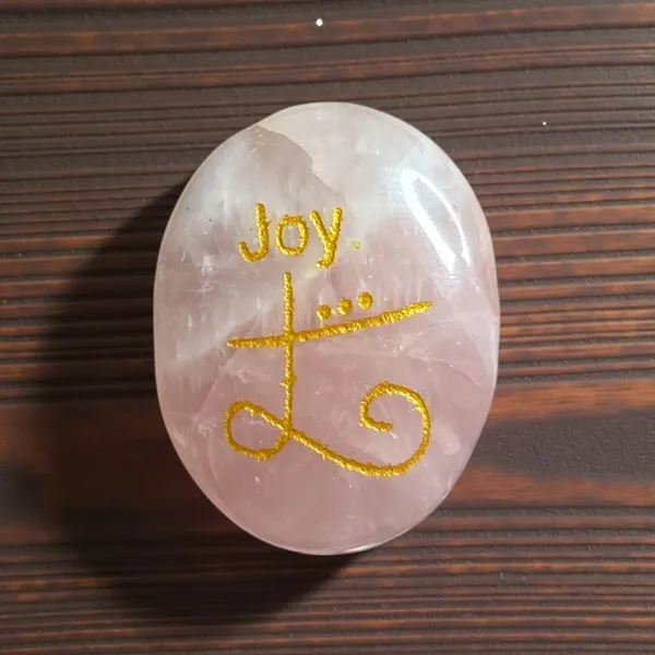 Zibu_Symbol_Palm_Stone_Joy_Symbol_Engraved_On_Rose_Quartz