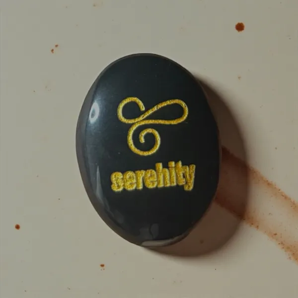 Zibu_Symbol_Palm_Stone_Serenity_Symbol_Engraved_On_Black_Tourmaline