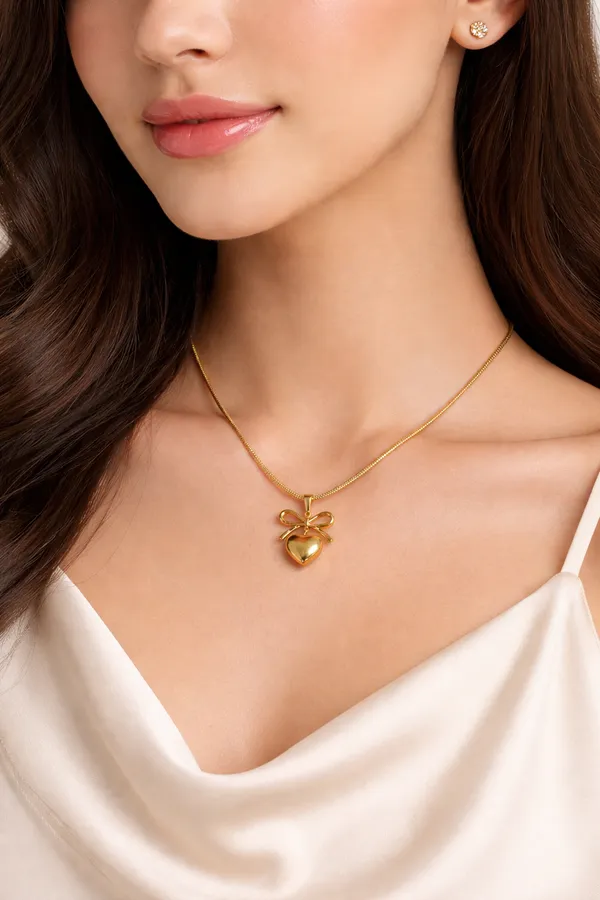 Elegant_Golden_Heart_Pendant_Necklace_With_Bow_Design